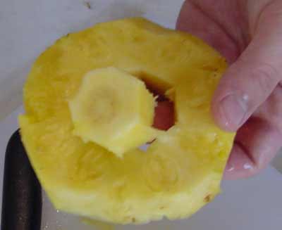cutting up a pineapple